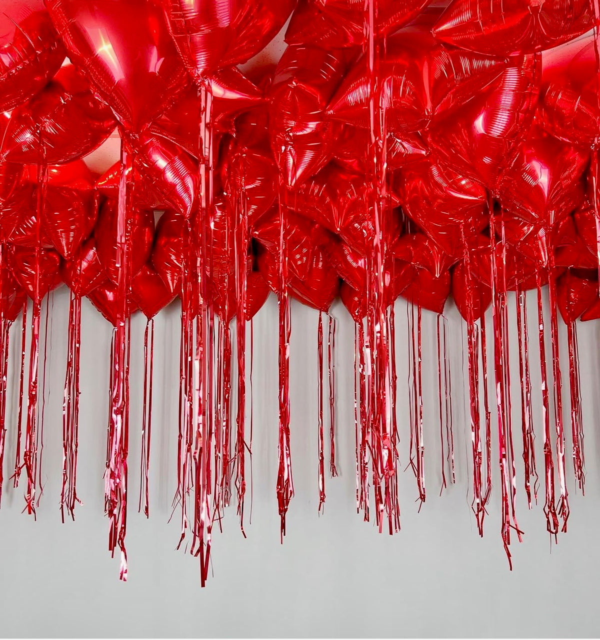25 Ceiling Heart Balloons with Red Tassel